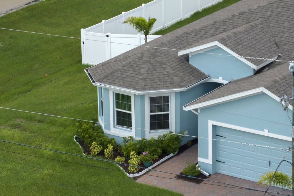 image of blue house and gray roof