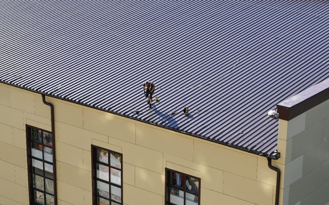 image of man on metal roof